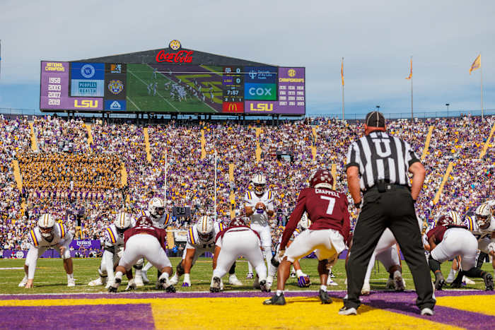 Nov 25, 2023; Baton Rouge, Louisiana, USA; LSU Tigers quarterback Jayden Daniels (5) calls for the ball against Texas A&M Aggies defensive back Tyreek Chappell (7) during the first half at Tiger Stadium.